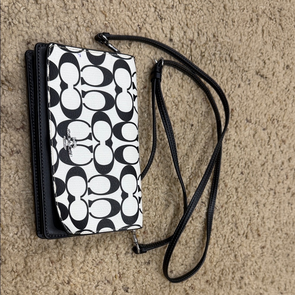Coach Monogram Black and White Crossbody bag.